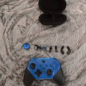 Blue and Black Xbox Controller with Accessories